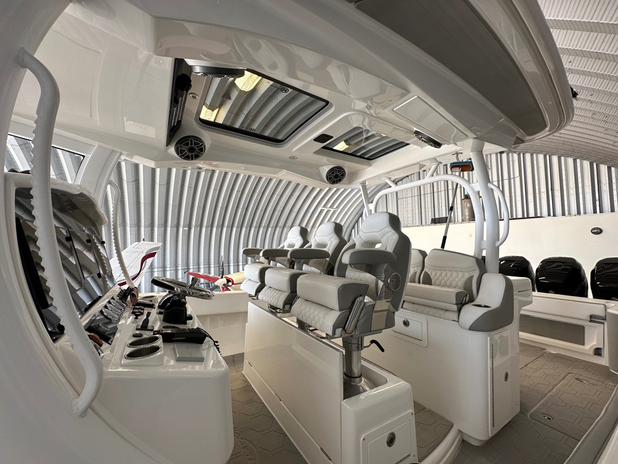Blackwater boat helm, white seating and hardtop interior details