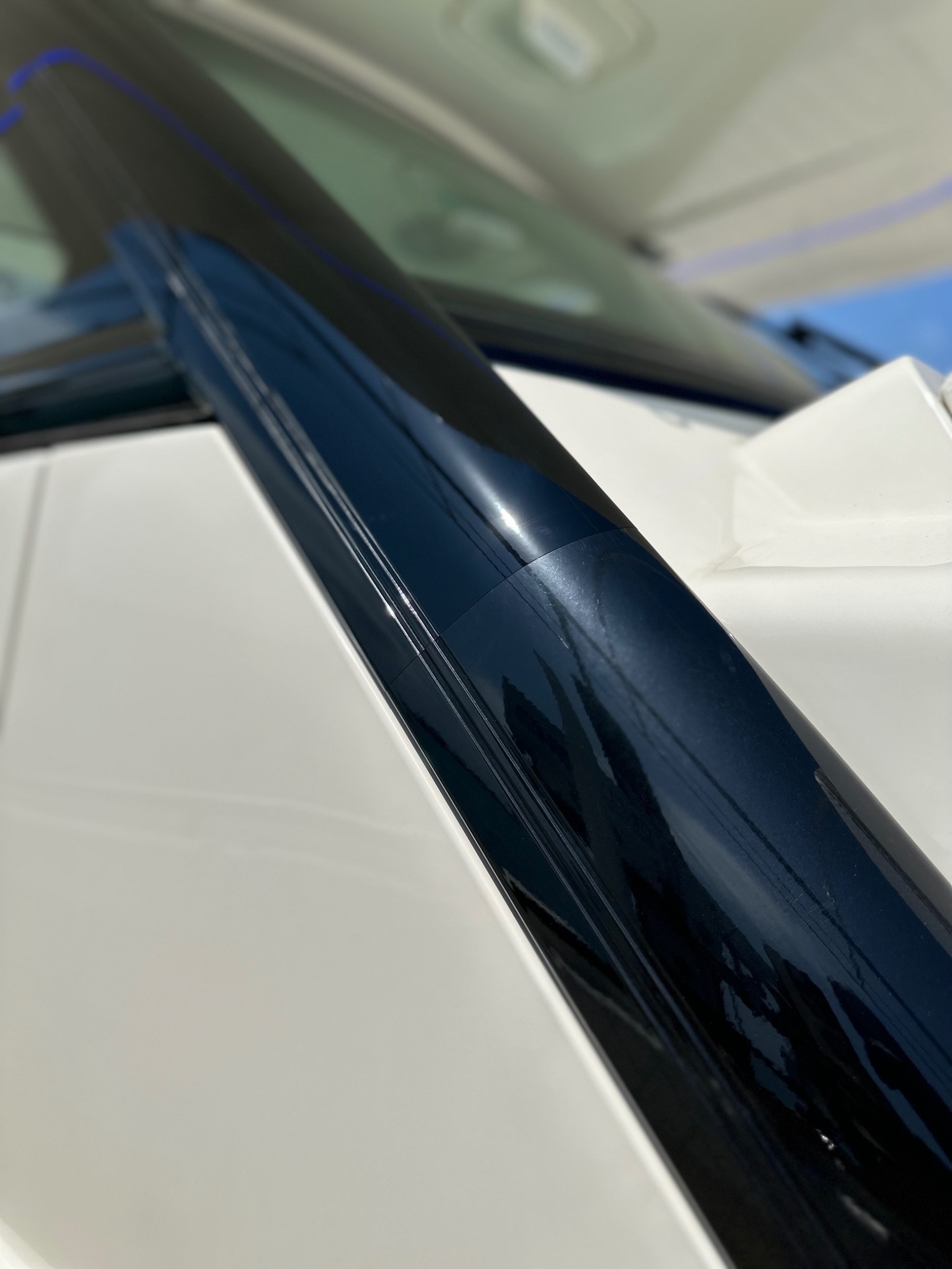 Glossy dark blue marine rail detail