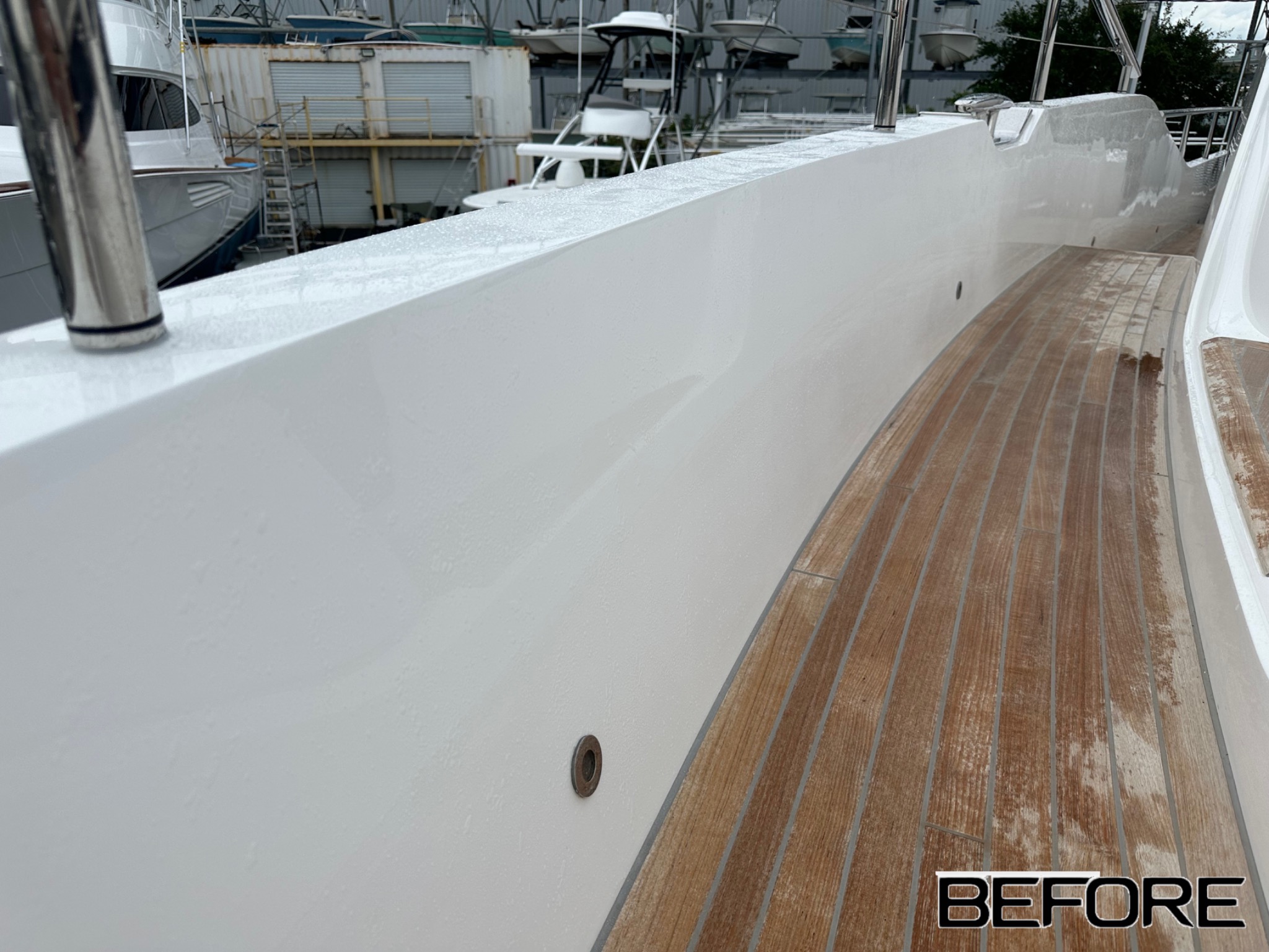 Before: white boat hull side before the completed finish