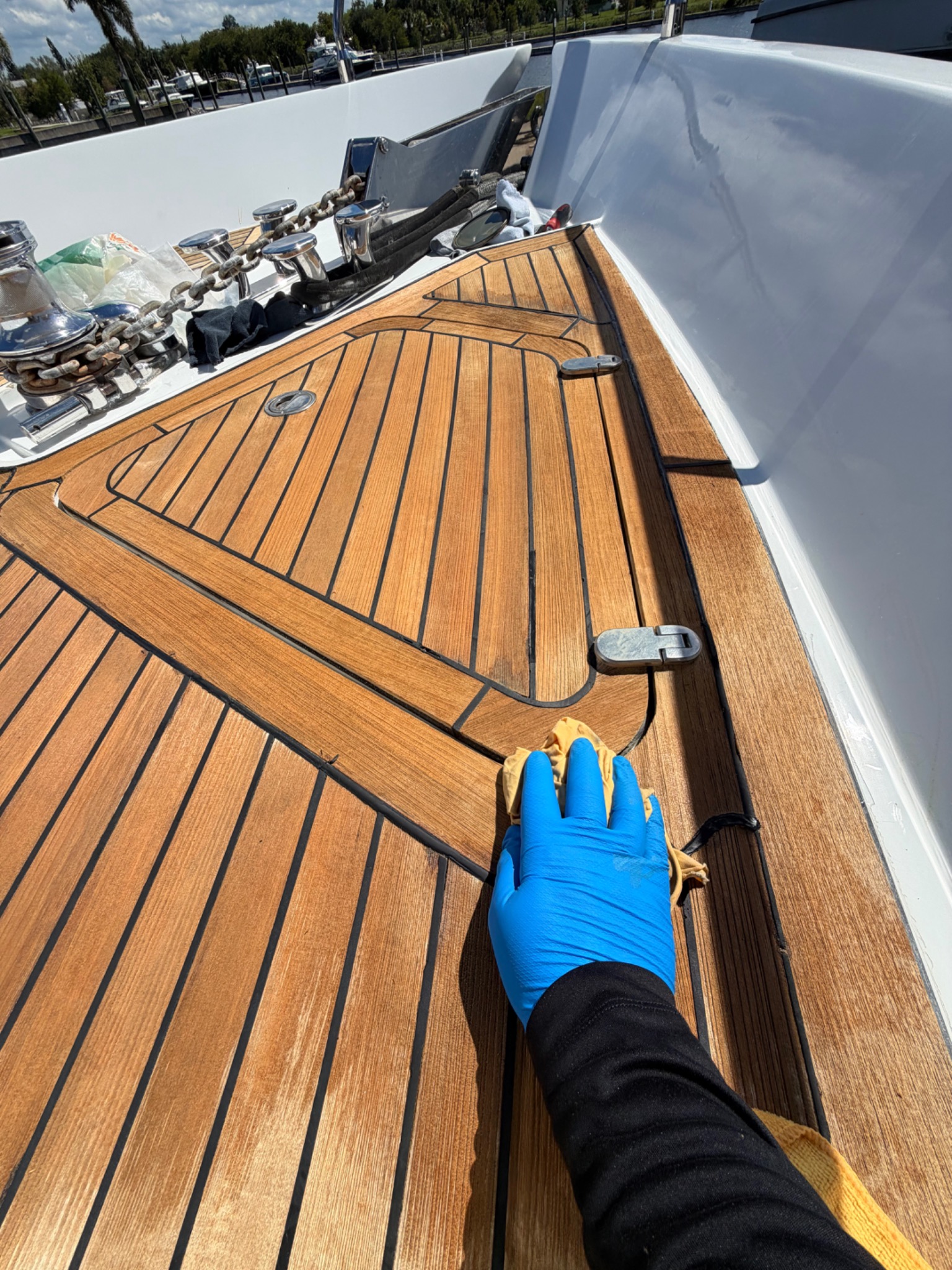 Hands-on teak deck care aboard a boat