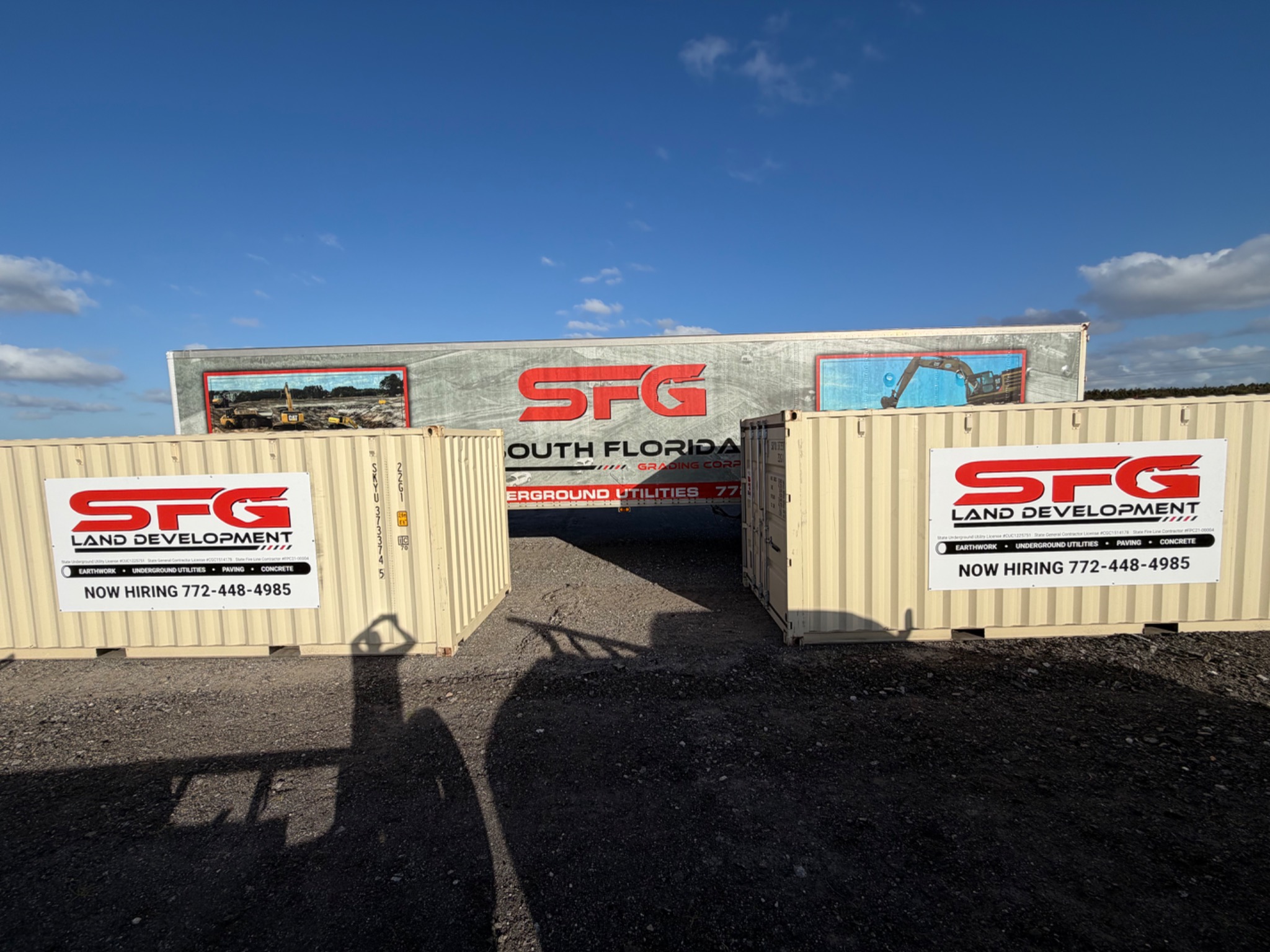 Business branding on site containers and a commercial trailer