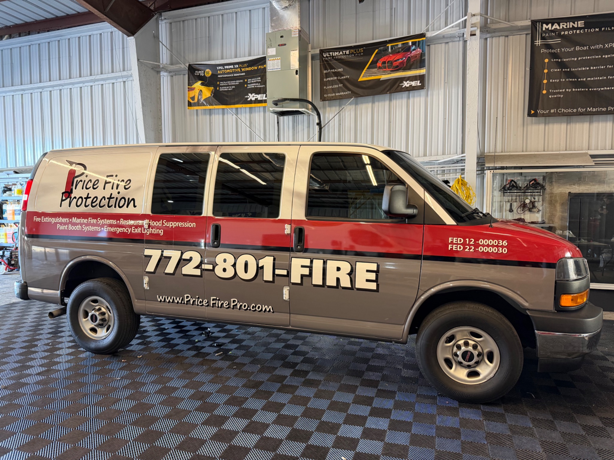 Commercial service van with company graphics and contact details