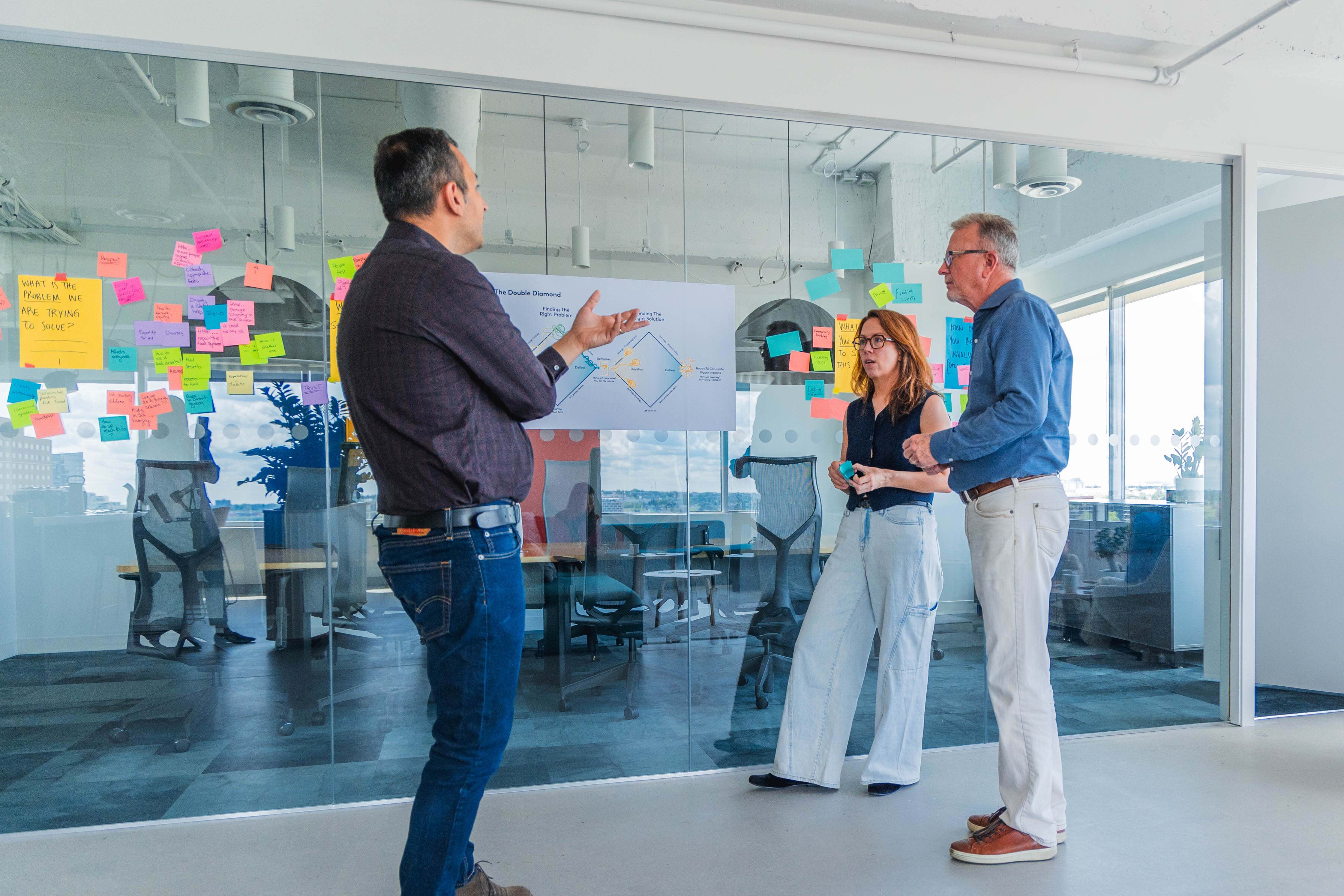 A team of people standing and talking.