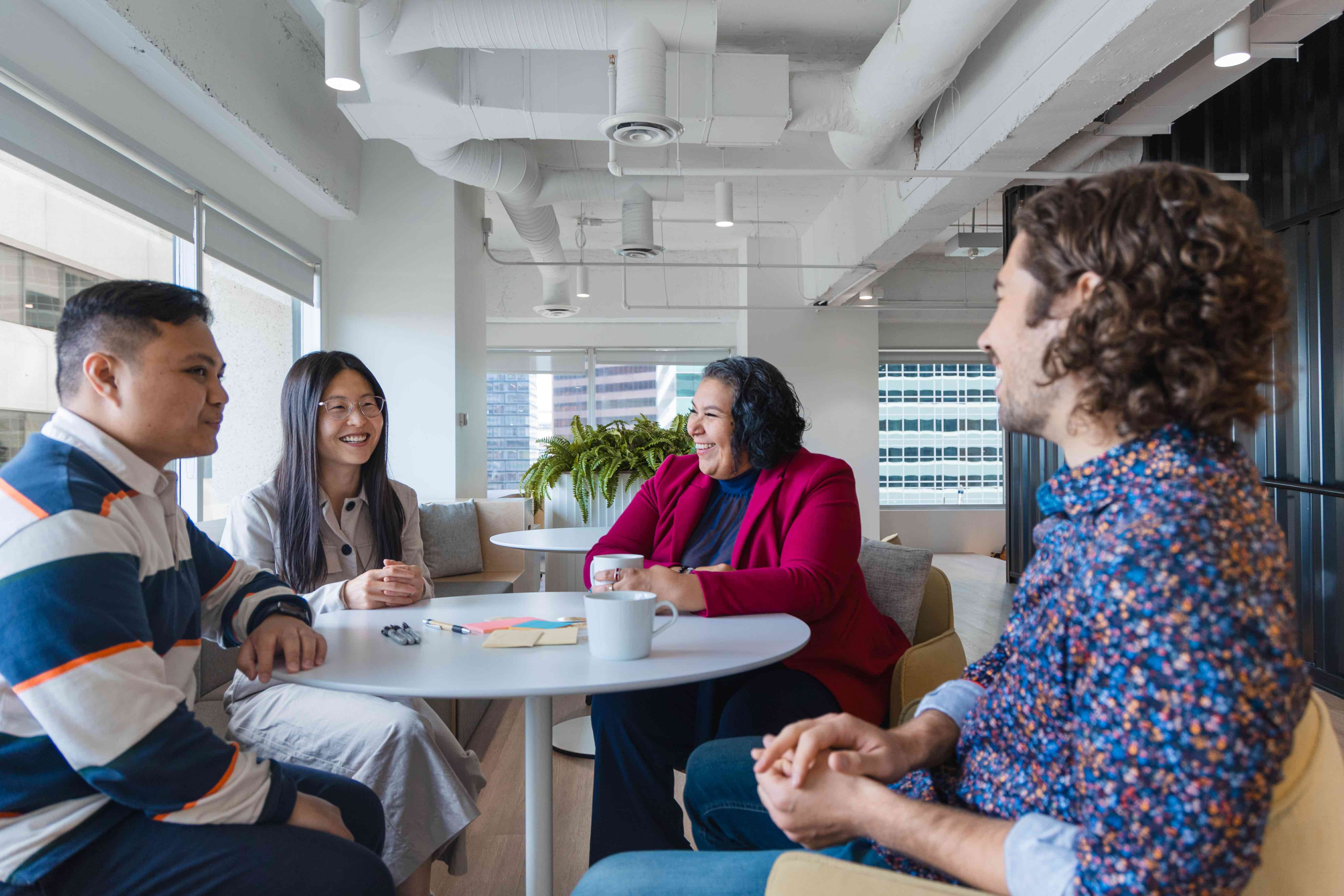 People sitting around a table having a lively conversation.