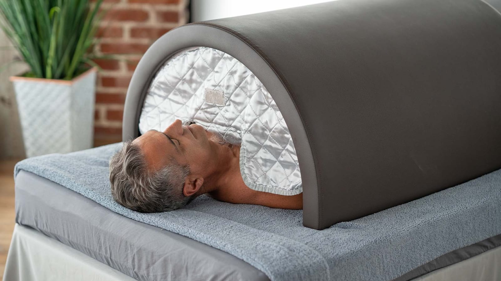 A man enjoying the infrared sauna.
