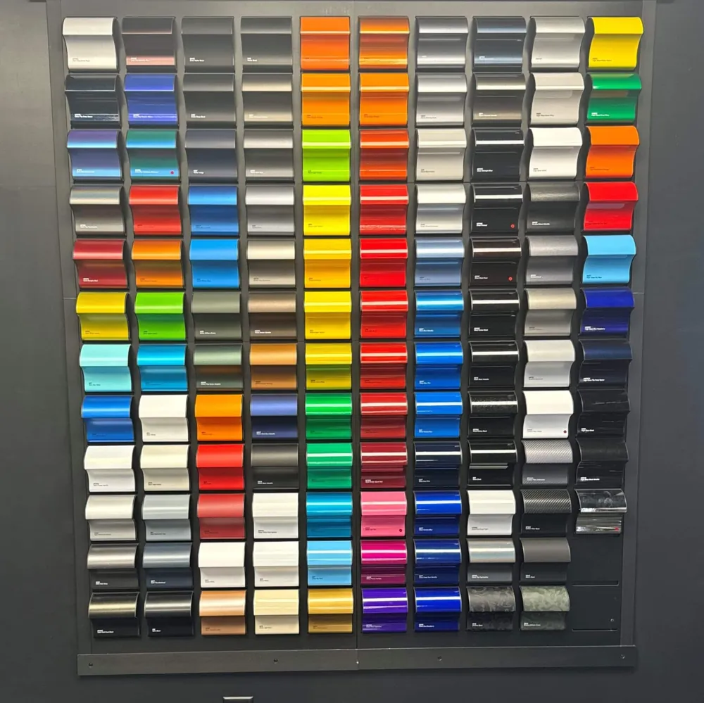 Wall of vinyl wrap colour samples at the Unique Tints studio, Auckland.