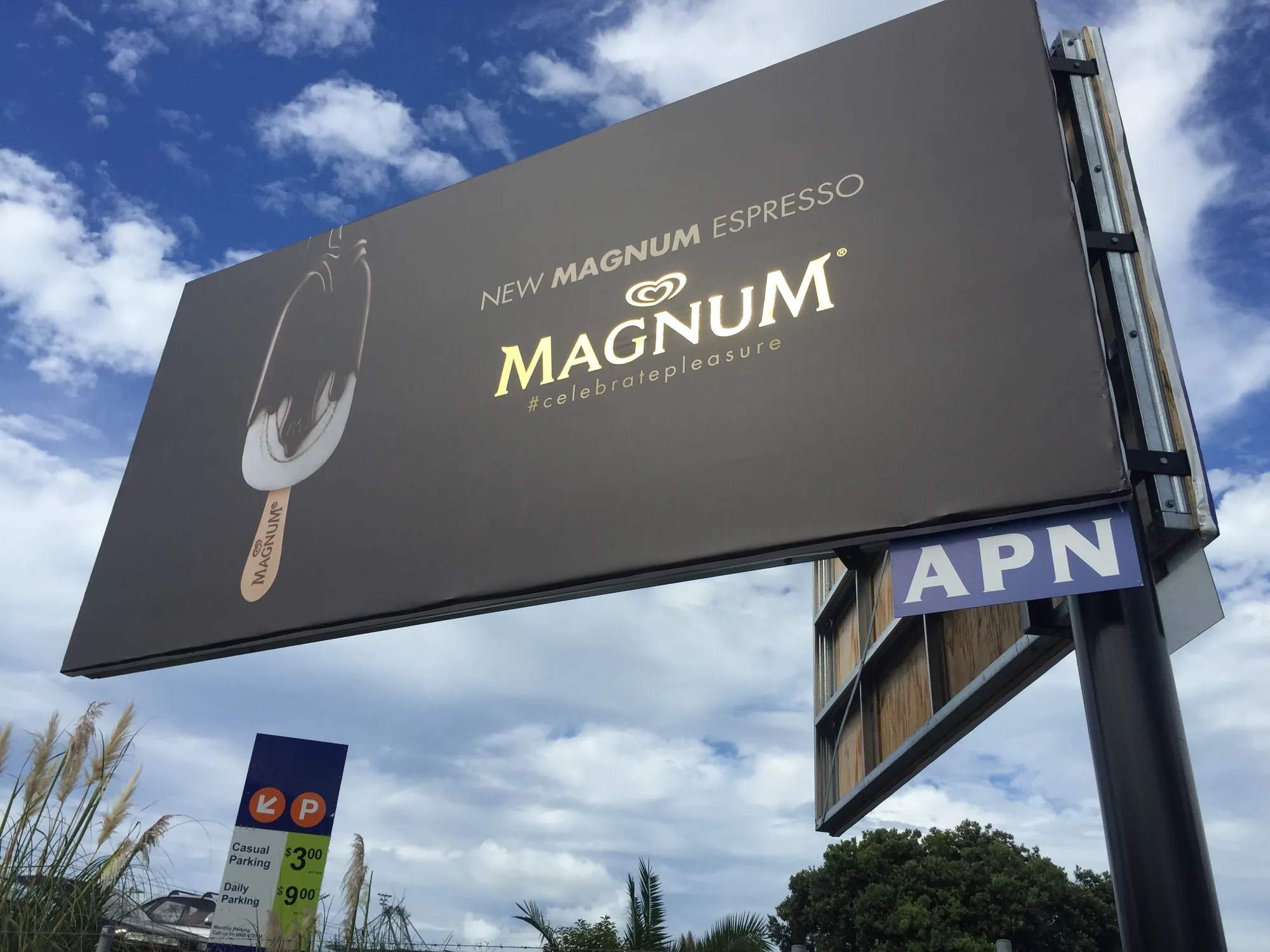 Magnum Espresso gold vinyl shopfront signage by Unique Tints.