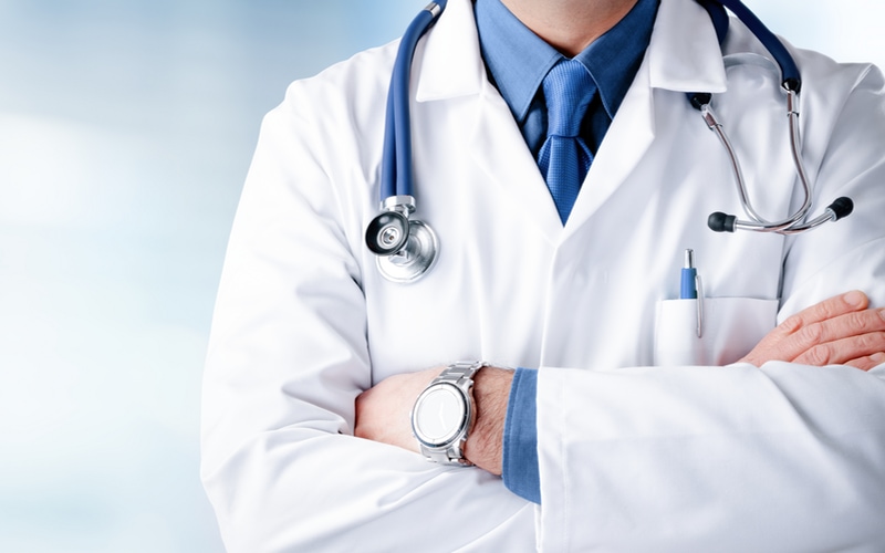 Doctor with stethoscope, arms crossed