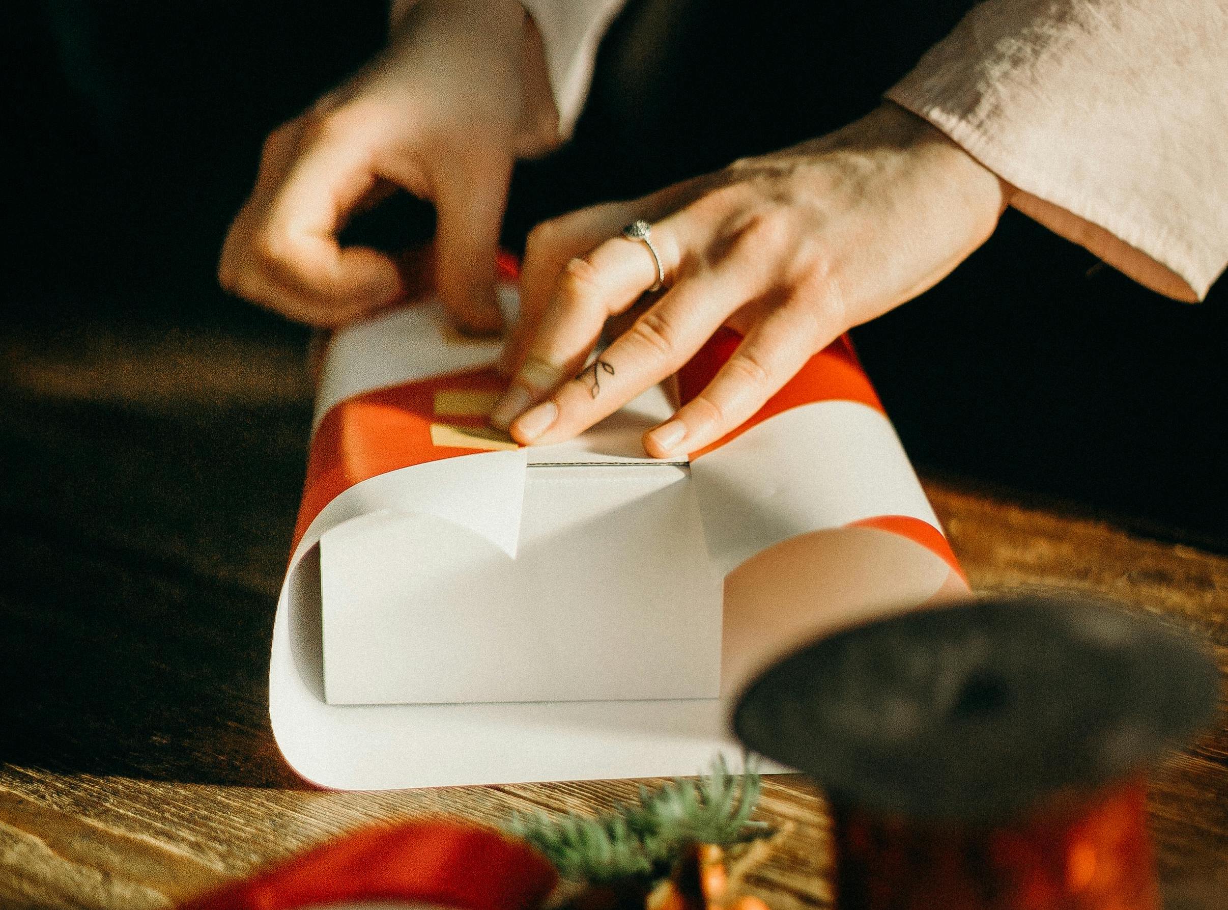 Person wrapping a gift box