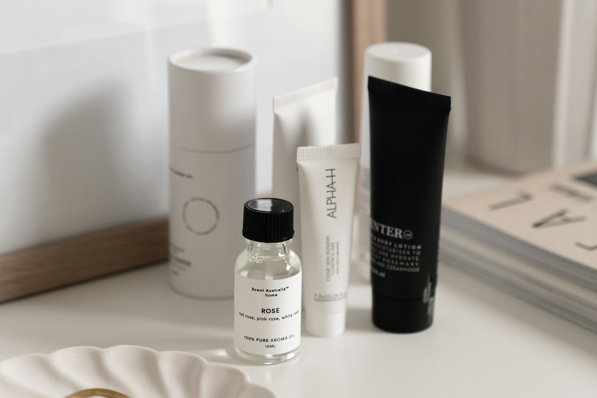 Assortment of skincare products in the corner.