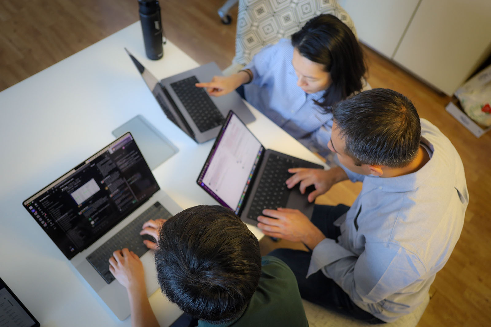 Streamline team working on laptops 