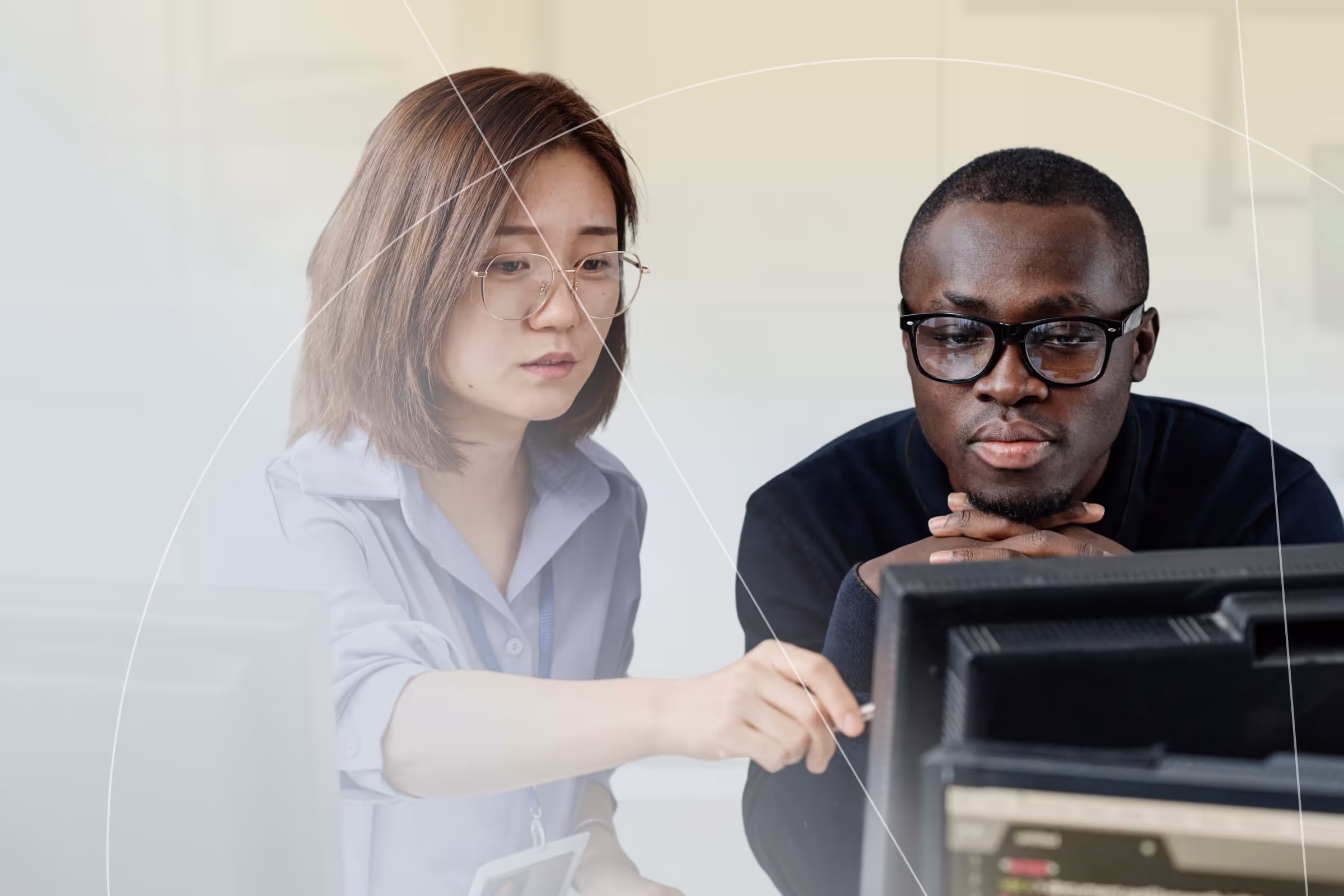 A business woman pointing out something on a computer screen