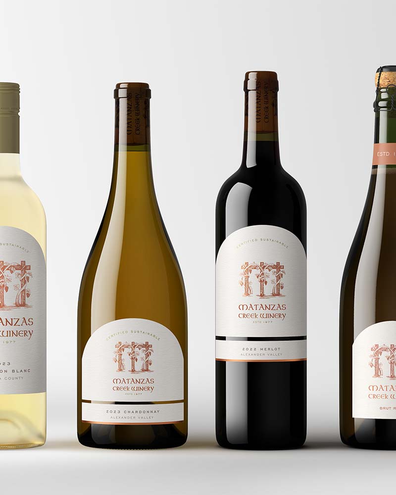 Sonoma wine bottles photographed by Outshinery on a simple minimalistic grey background