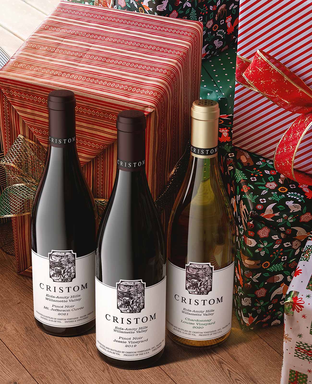 Three Paul Launois champagne bottles styled with pinecones and winter botanicals on white background with red border.