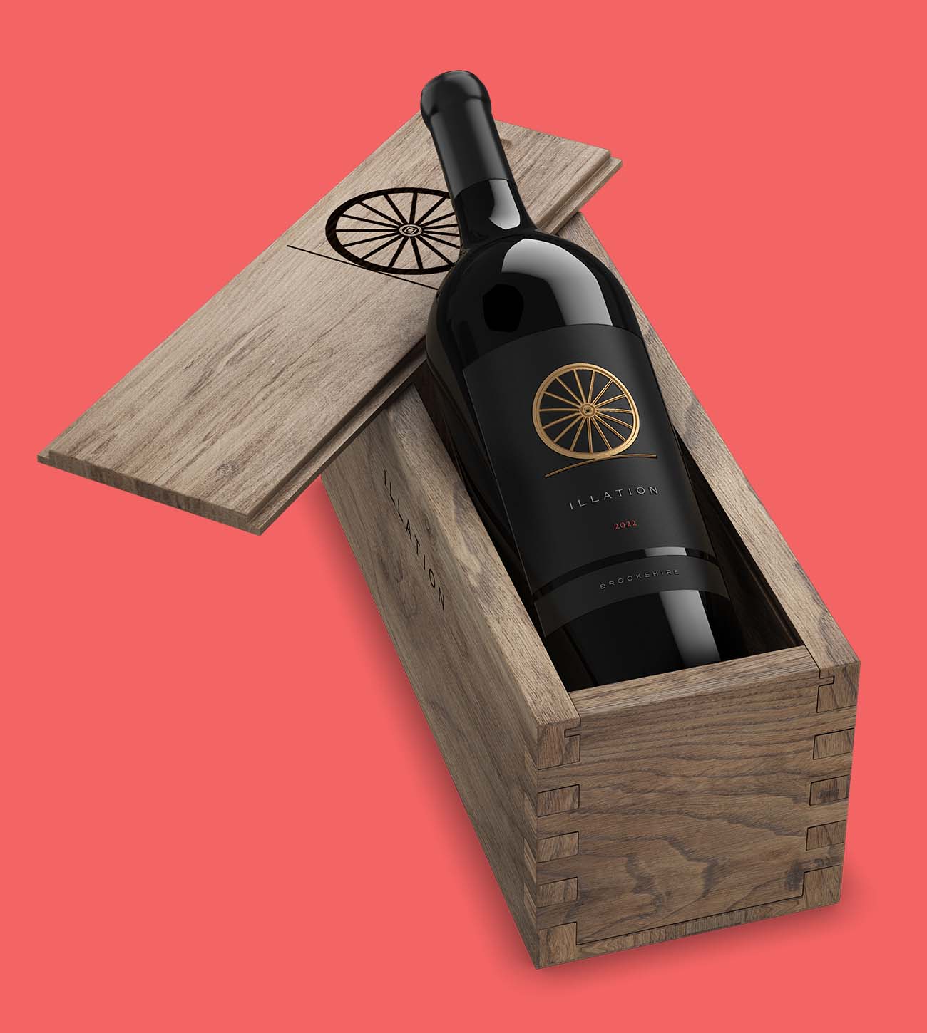 Dark glass wine bottle with an ornate label resting inside a rustic oak wooden box
