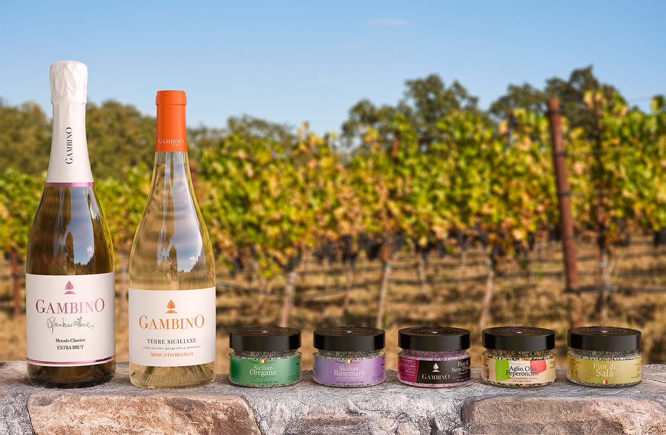 Wine bottles and spices placed in vineyard environment for marketing lifestyle imagery created from digital bottle twins