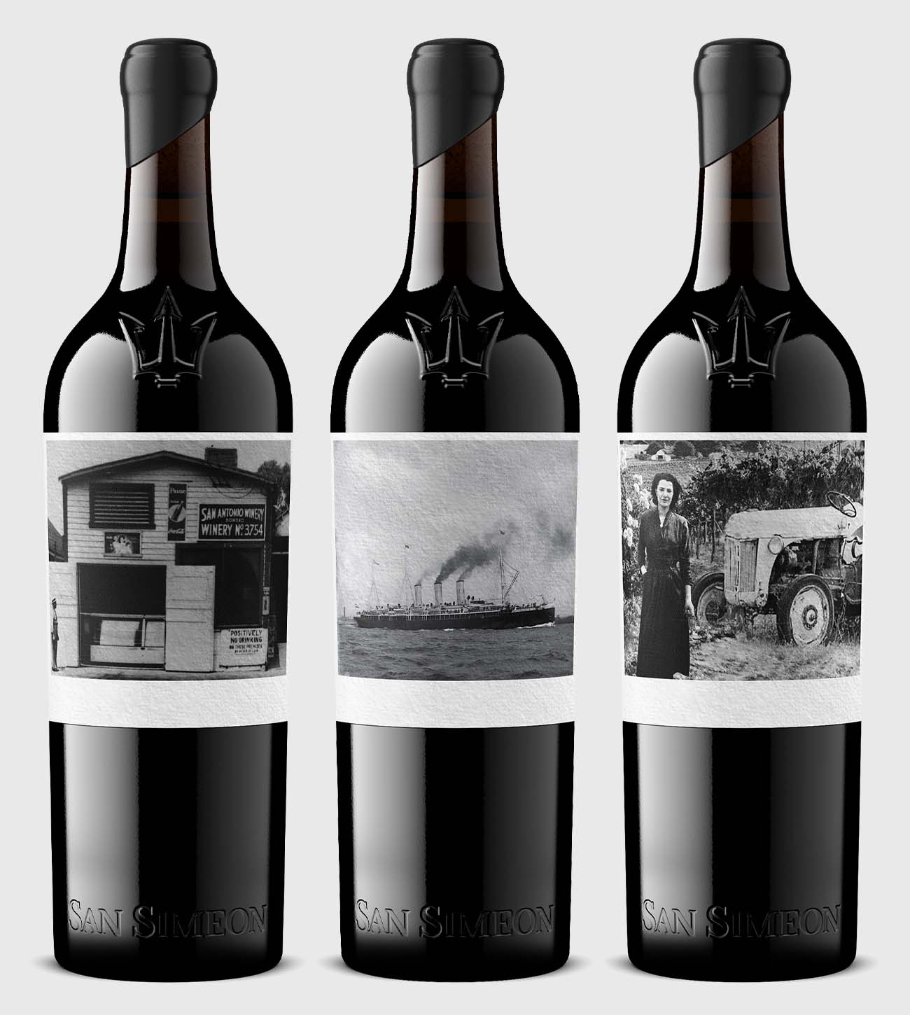 Three bottles featuring highly creative, story-driven label artwork photographed in a consistent studio setup.