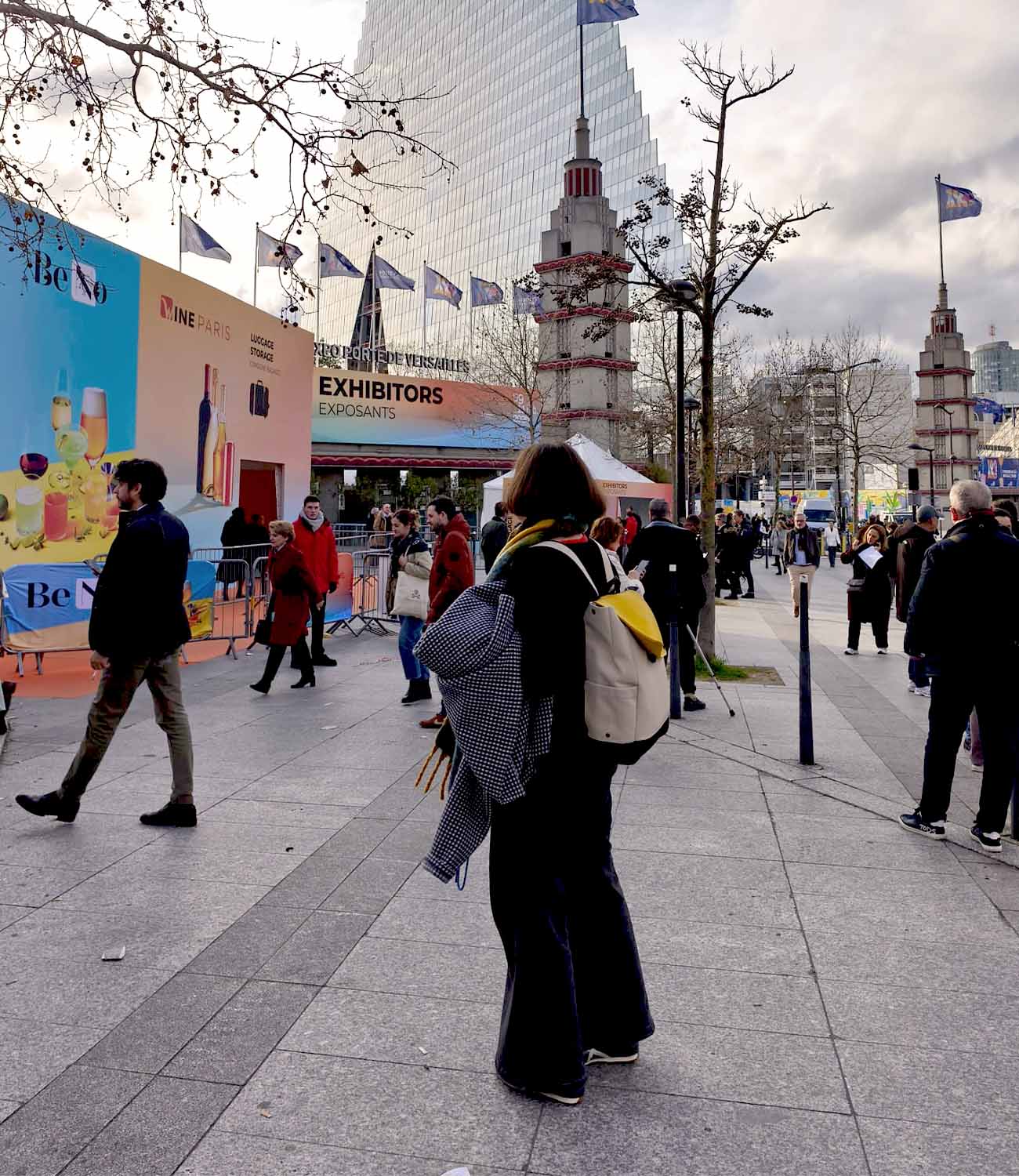 Wine Paris trade show entrance with attendees walking between exhibition halls at Vinexposium in Paris