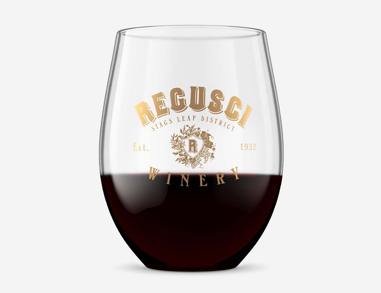 branded wine tumbler with gold winery logo with red wine