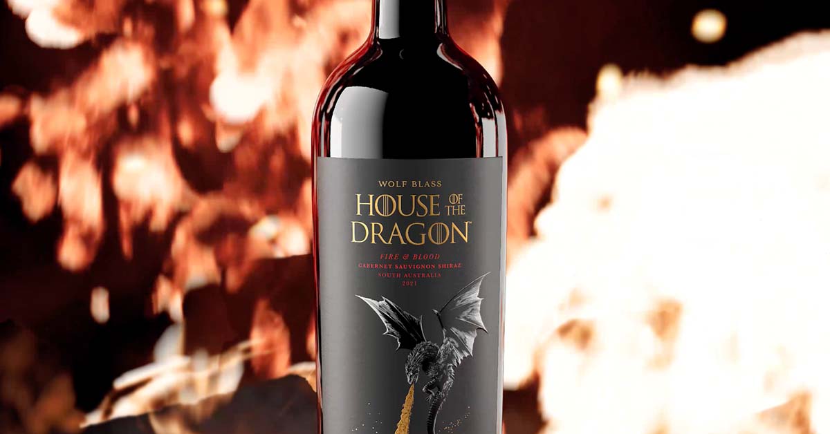 House of the Dragon Australian red wine bottle amongst flames