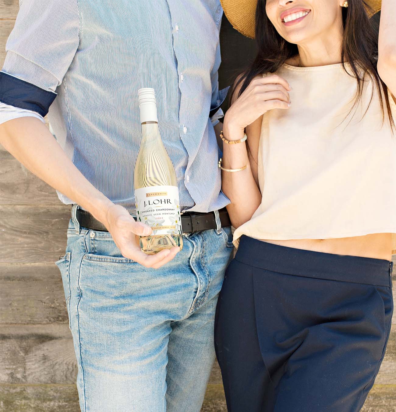 J. Lohr Chardonnay lifestyle wine product photography, couple casually holding bottle outdoors