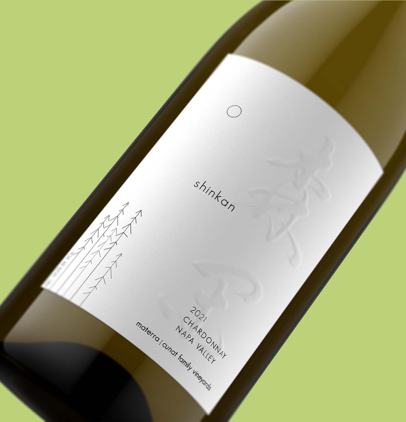 Close-up of Shinkan 2021 Chardonnay by Materra Cunat Family Vineyards showing embossed label detail, Napa Valley wine bottle photography