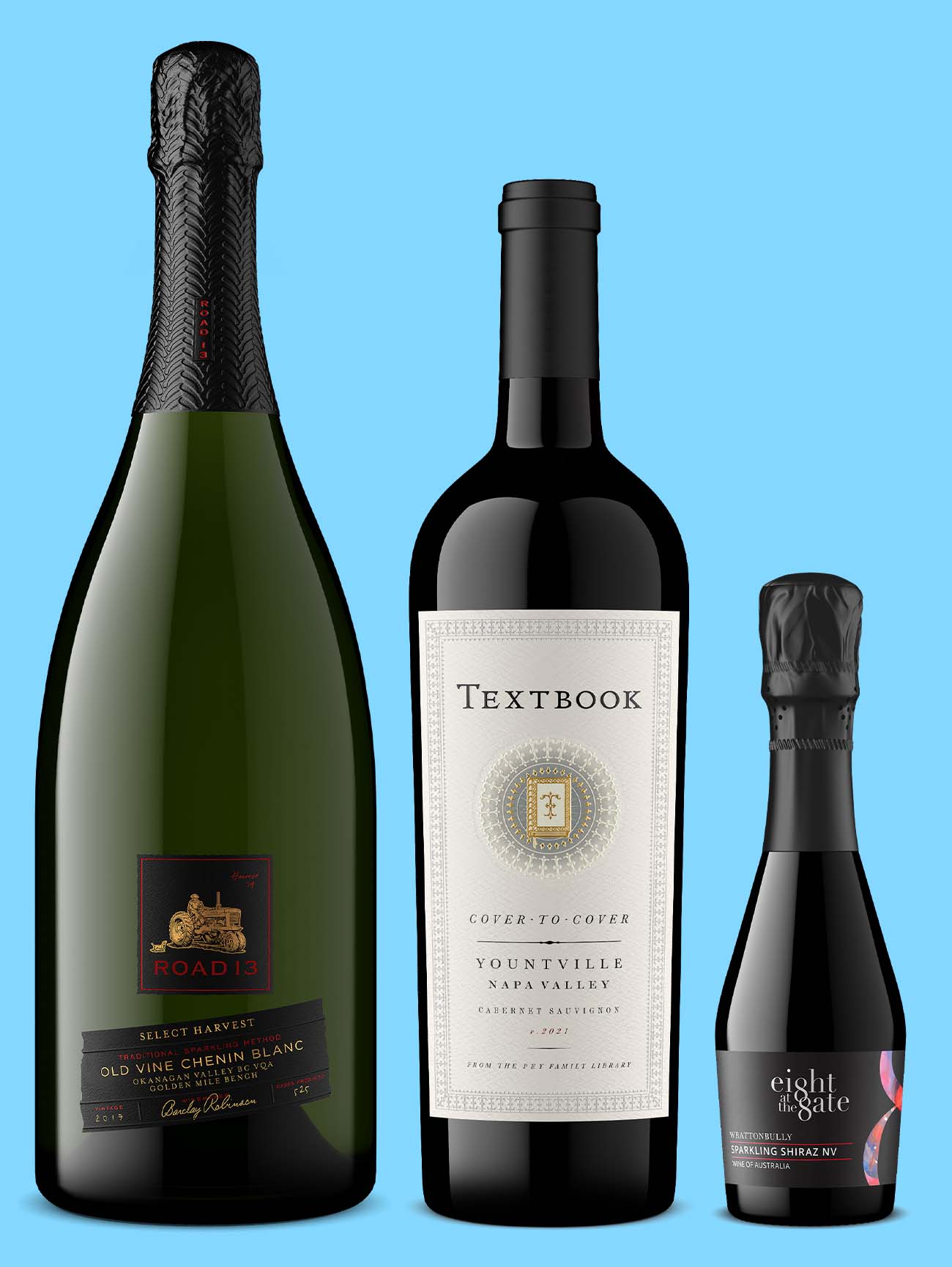 sparkling wine bottle, Napa Valley Cabernet Sauvignon and small Australian sparkling Shiraz on blue background