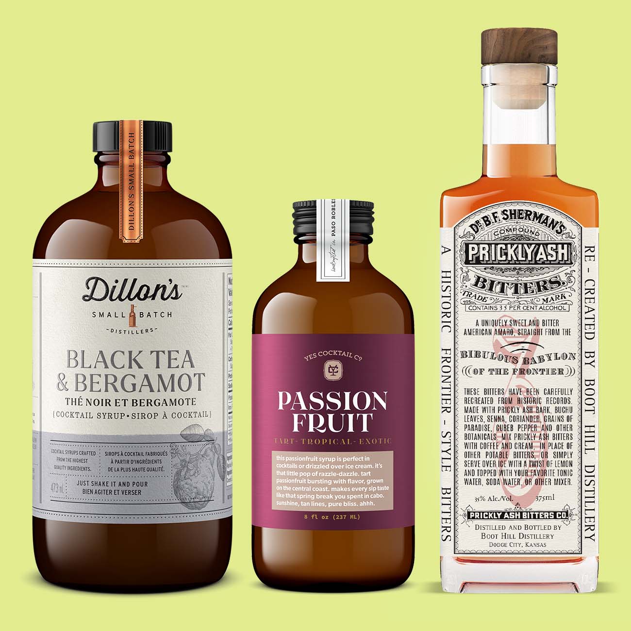 small bottles of bitters and syrups with retro designs to make the perfect cocktails
