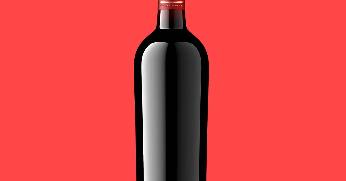 Photorealistic 3D bottle shot of a dark Gibbs Wines red wine bottle on a coral background, with glass highlights and deep edges cleanly controlled
