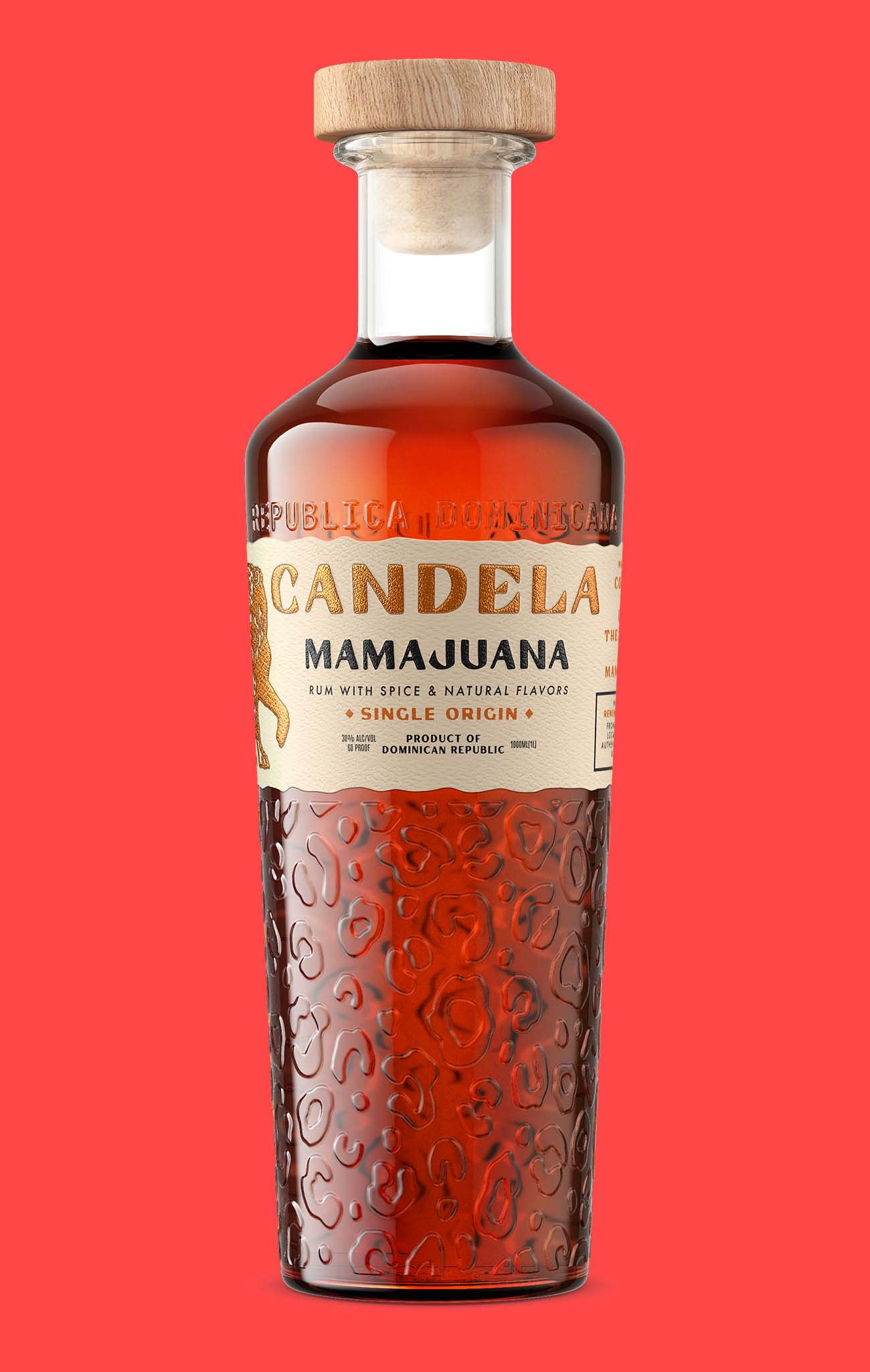 Candela Mamajuana single origin rum bottle shot with a gold foil label and embossed glass, label glare controlled without flattening the print