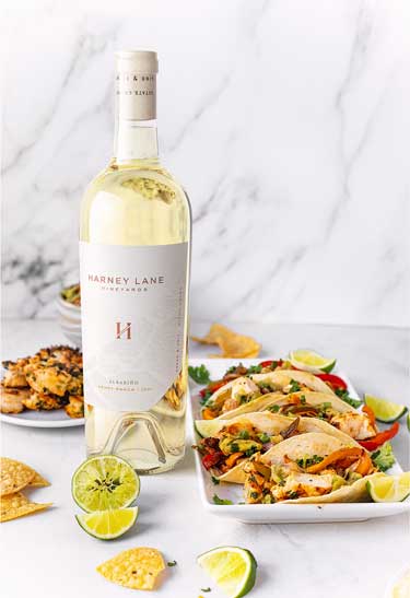 Harney Lane Vineyards Albarino from Henry Ranch in Lodi, bottle styled with fish tacos and lime, by Outshinery