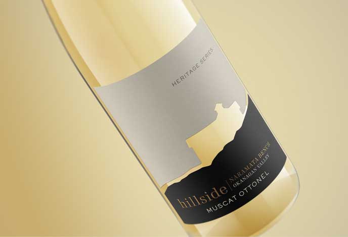 Hillside Heritage Series Muscat Ottonel from Naramata Bench, label close-up on a warm gold background, by Outshinery