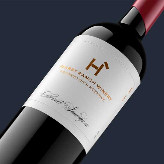 Hearst Ranch Winery Proprietor's Reserve Cabernet Sauvignon 2020 bottle close-up with red capsule, by Outshinery