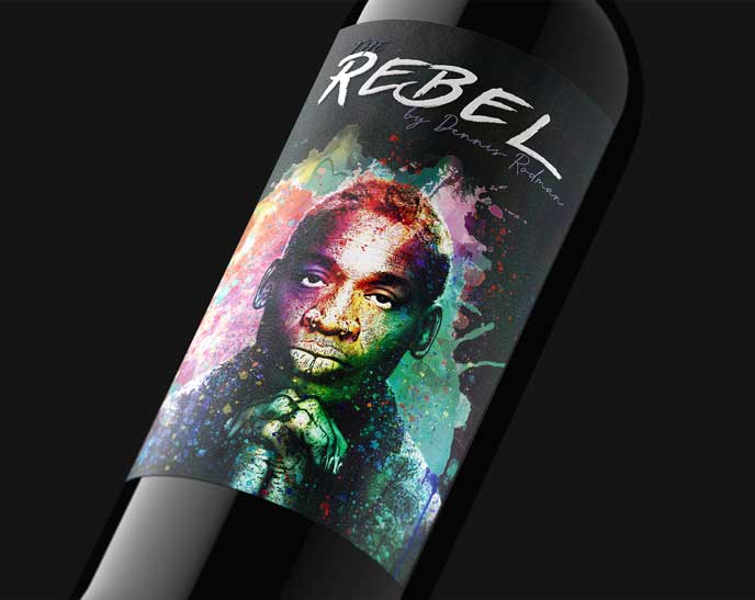 The Rebel by Dennis Rodman bottle close-up, full-color splatter-art portrait label on a black backdrop, by Outshinery