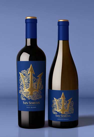 San Simeon Red Blend and Chardonnay bottles, gold trident on cobalt labels against a blue backdrop, by Outshinery