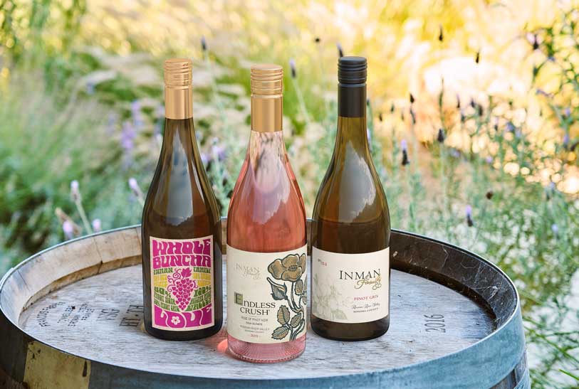 Inman Family lineup, Whole Buncha Love, Endless Crush Rose of Pinot Noir and Pinot Gris, on a barrel head, by Outshinery