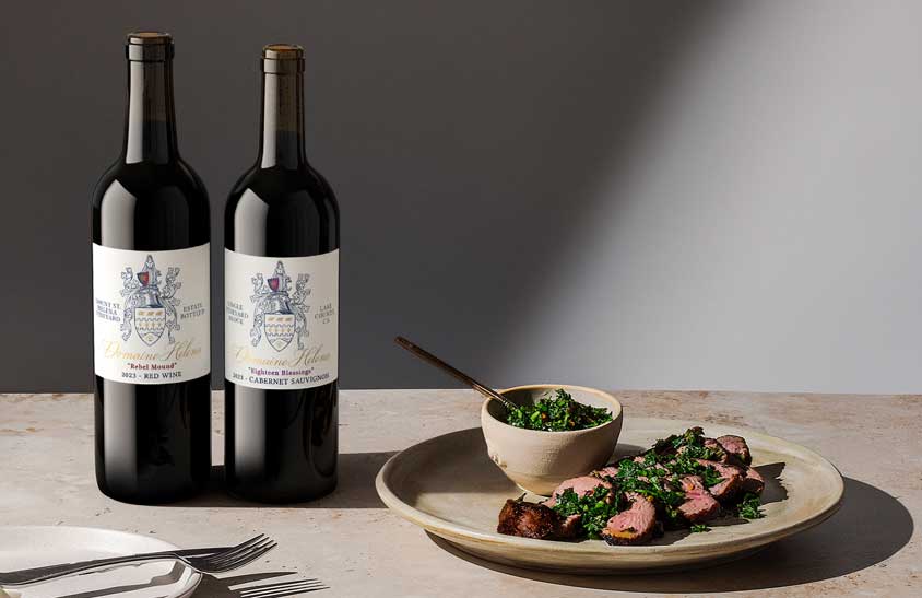 Domaine Helena Rebel Mound red wine and Eighteen Blessings Cabernet Sauvignon 2023 bottles with sliced steak and chimichurri, by Outshinery