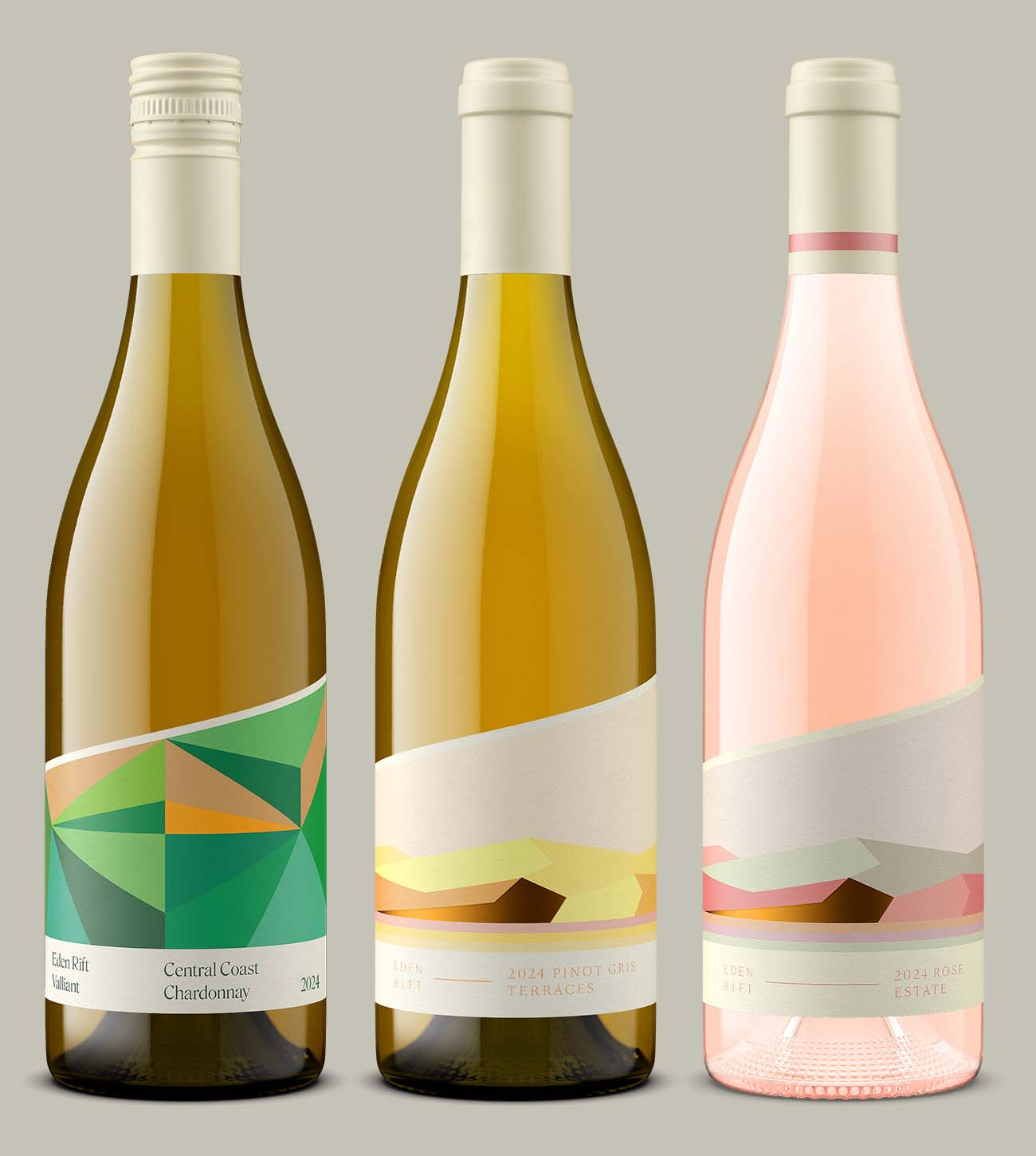 Three Eden Rift wines, Central Coast Chardonnay, Pinot Gris Terraces, and Rose Estate, shown in photorealistic bottle shots with matching label design across the 2024 lineup, demonstrating a visual standard held consistently across a wine portfolio