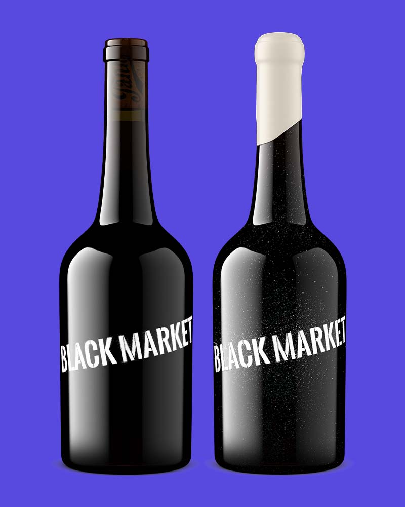 Two Black Market wine bottles with different glass finishes and capsule colors, showing how packaging revisions change the product shot