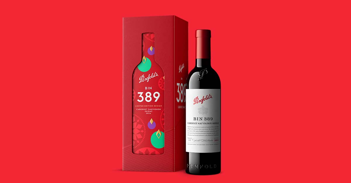 Penfolds Bin 389 Cabernet Shiraz bottle beside its red limited-edition holiday gift box, an example of limited-edition wine packaging visuals
