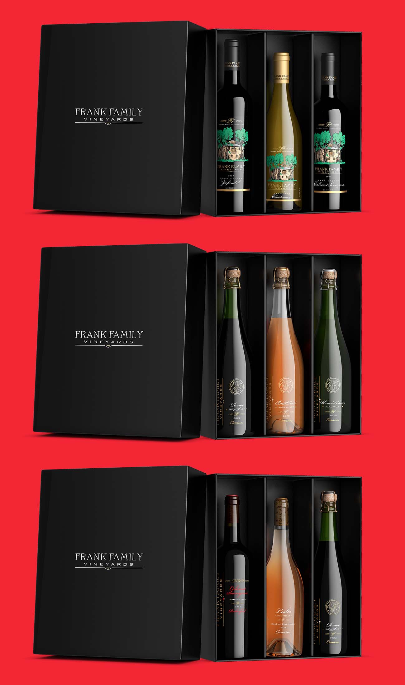 Three open black wine gift boxes from one winery, each holding three bottles: a red and white set, a sparkling set and a mixed set