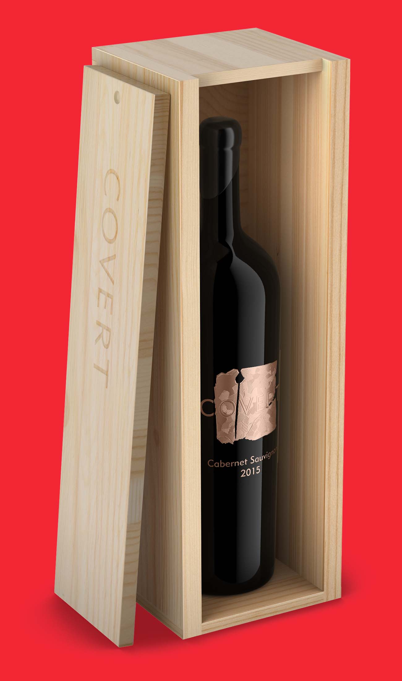 Open pine wine case with an engraved sliding lid, holding a 2015 Cabernet Sauvignon bottle with a copper label, a limited-edition wooden case