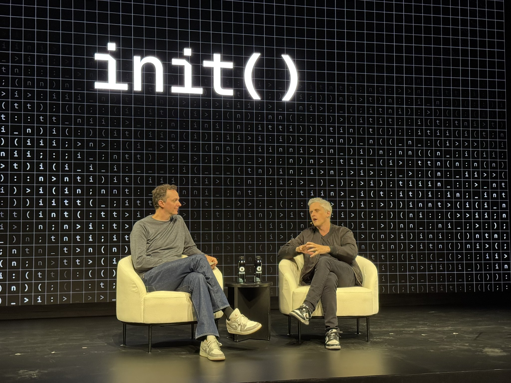 Aaron Levie and Michael Grinich seated on stage during their fireside chat at init().