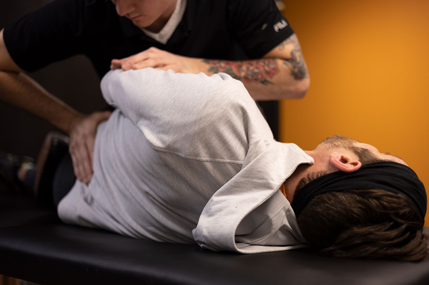 Physical therapist treating shoulder pain with manual therapy at Unbound Physical Therapy in Mandan, North Dakota"