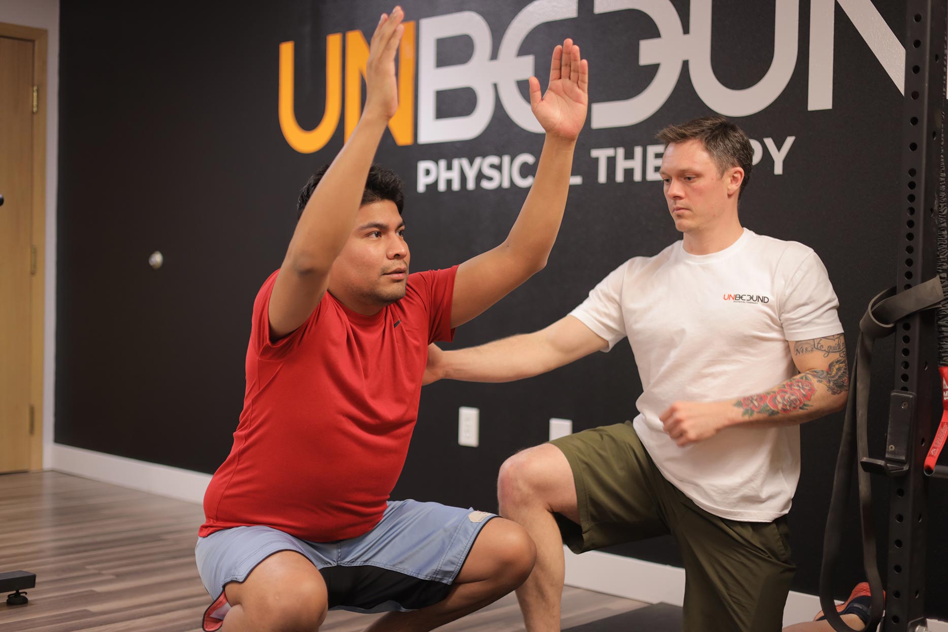 Physical therapist working one-on-one with active adult in Mandan, ND clinic