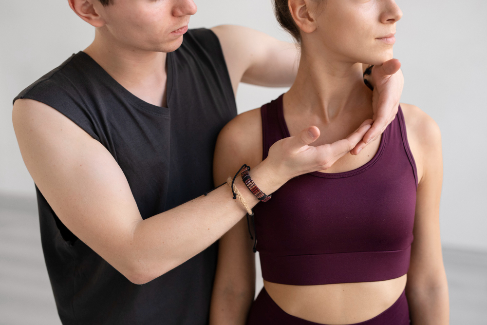 Physical therapist assessing shoulder mobility and range of motion at Unbound PT in Mandan, ND