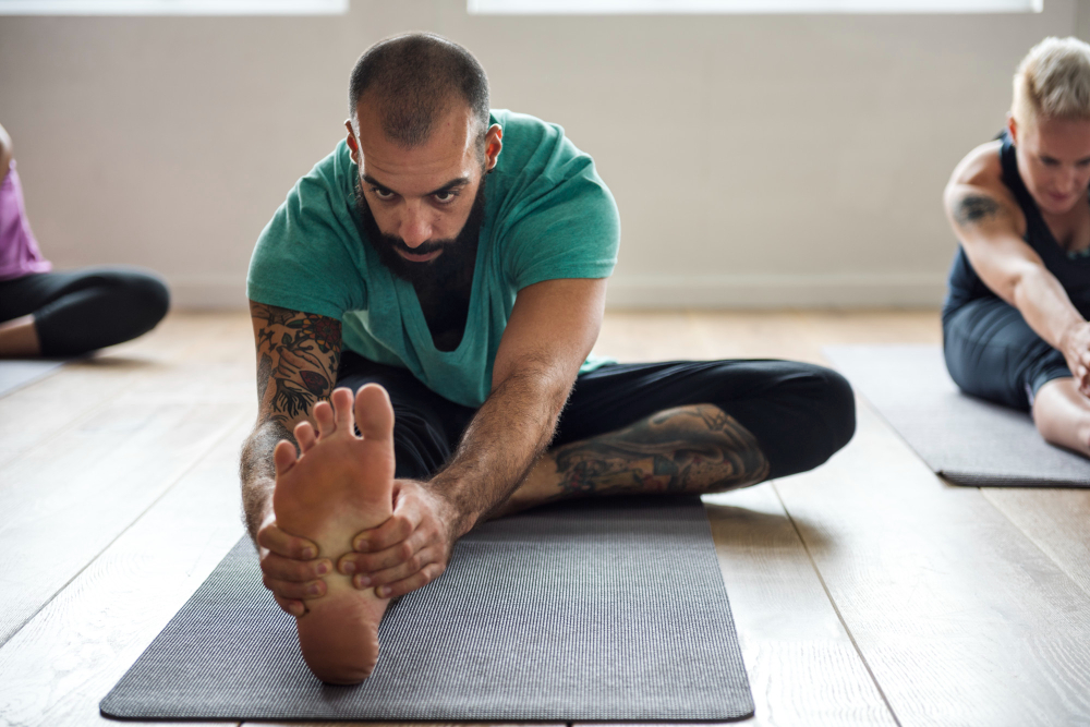 Physical therapist working one-on-one with active adult in Mandan, ND clinic