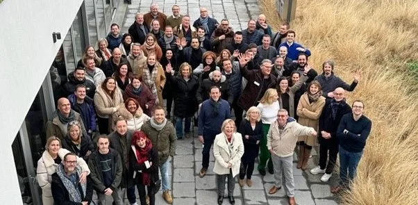Field & Concept and Mondelez team members posing together for a group photo outdoors