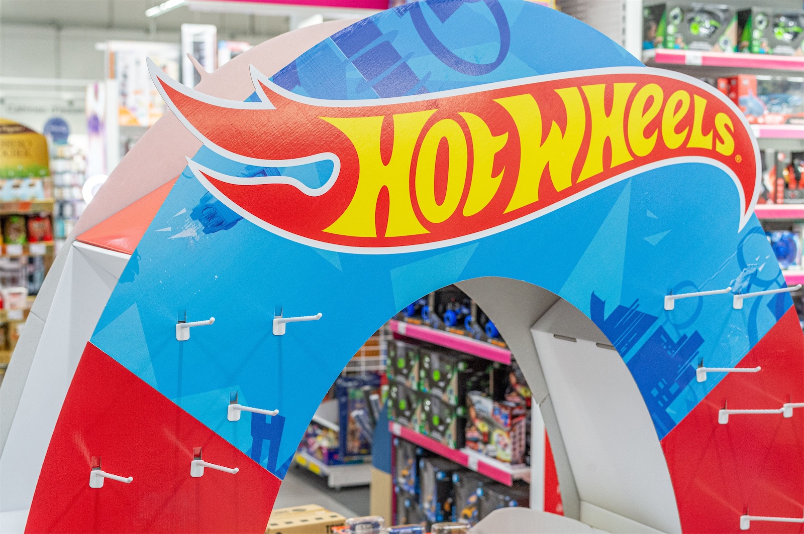 Hot Wheels branded archway display in a toy store aisle, part of a Field & Concept Mattel merchandising project
