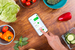 Person interacting with phone while cooking